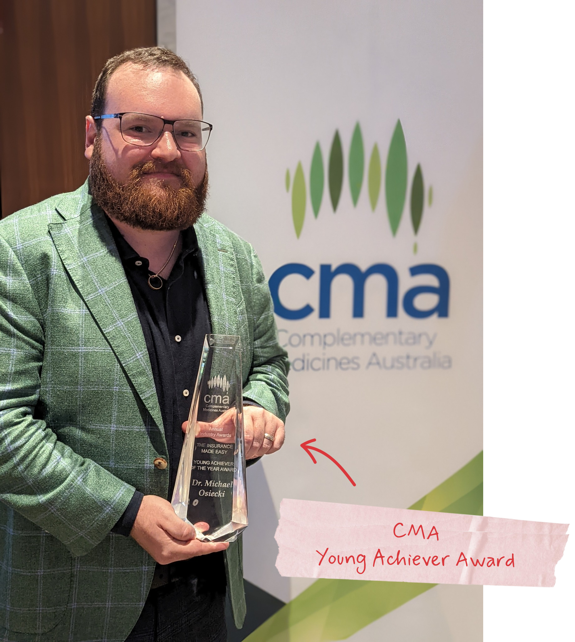 Michael holding his CMA Young Achiever Award